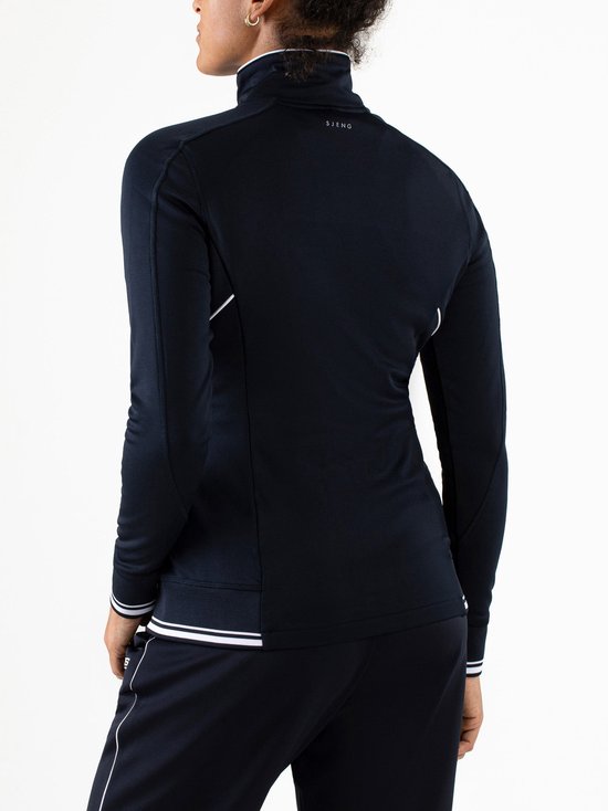 Donkerblauw trainingsjack voor dames met witte bies langs de rits en zoom. Merk: Sjeng Sports.