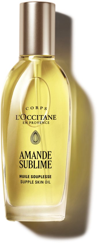 L'OCCITANE EN PROVENCE AMANDE SUBLIME SUPPLE SKIN OIL. Goudkleurige olie in glazen fles met gouden dop, op witte achtergrond.