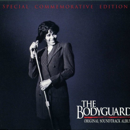 Whitney Houston in een pinstreep pak, zingend in een microfoon. Special Commemorative Edition. The Bodyguard Original Soundtrack Album.
