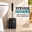 Zwarte toiletborstel met zwarte houder en M Michilo logo, naast een witte toiletpot.
