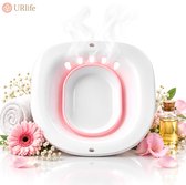 Witte vaginale stoombad zitting met roze accenten, stoom en bloemen.