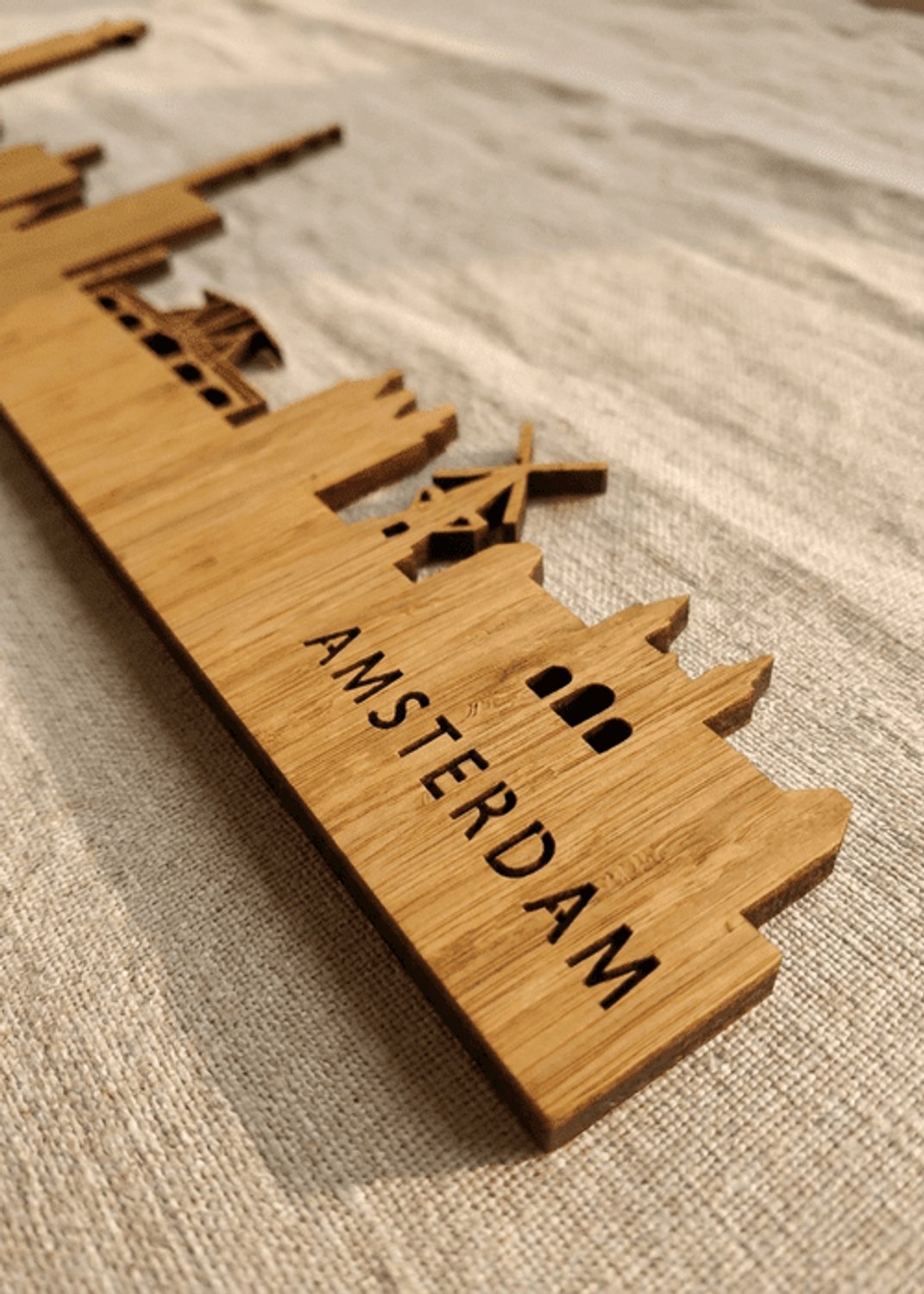 Houten Skyline Amsterdam | Wanddecoratie voor aan de muur | Bamboe | 100 cm breed
