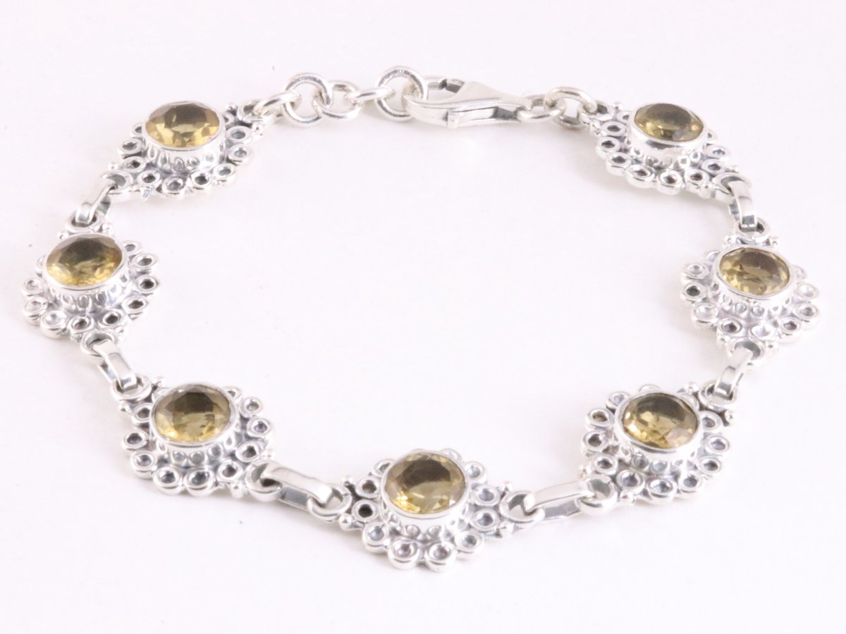 Bewerkte zilveren schakelarmband met citrien