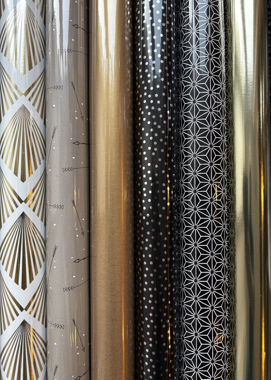 Zes rollen luxe inpakpapier in goud, zilver en zwart met art-deco, stippen en geometrische patronen.