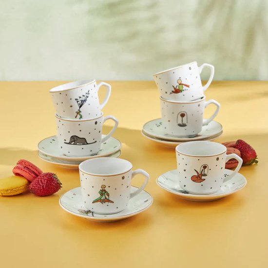 Set van vier porseleinen espressokopjes met Le Petit Prince-illustraties, gouden rand en bijpassende schotels.