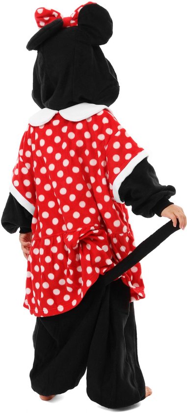 Kind in een zwart Minnie Mouse kostuum met rode polkadot jurk, witte kraag, strik en oren, met staart zichtbaar.