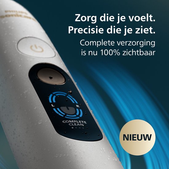 Close-up van de zilverkleurige tandenborstel met een digitaal display dat 'COMPLETE CLEAN' toont en een 'NIEUW'-sticker.