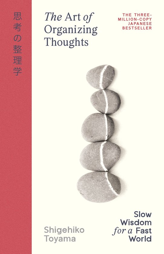 Boek "The Art of Organizing Thoughts" met gestapelde, grijze stenen met witte strepen voor een witte achtergrond met rode rand.