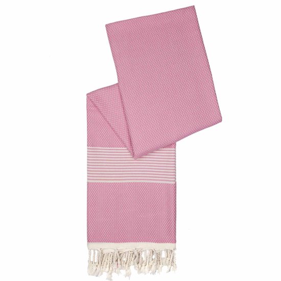 Roze hamamdoek met off-white strepen aan één uiteinde en franjes. De stof heeft een textuur van kleine vierkantjes.