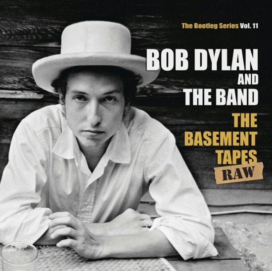 Bob Dylan met hoed en blouse, met tekst: The Bootleg Series Vol. 11, Bob Dylan and The Band, The Basement Tapes Raw.