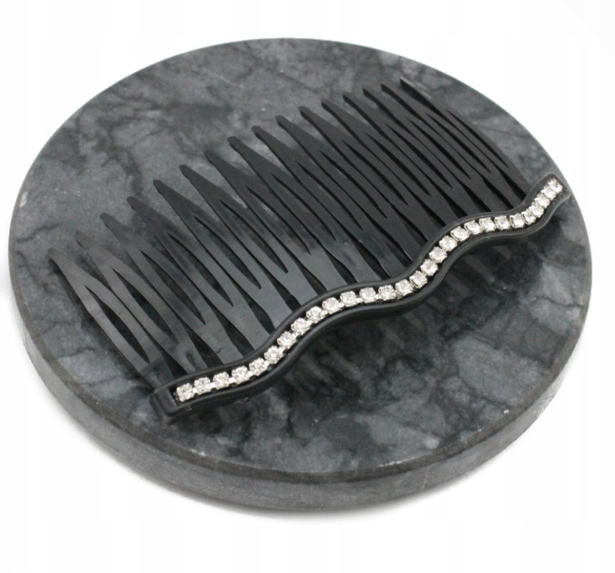 Grote zwarte haarspeld met golvend design en strass steentjes
