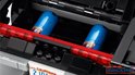 Zwarte LEGO Technic Dodge Charger met rode lichten en twee blauwe cilinders.