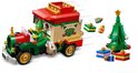 LEGO Santa's Delivery Truck met elf achter het stuur, kerstboom en cadeautjes die uit de truck vliegen.