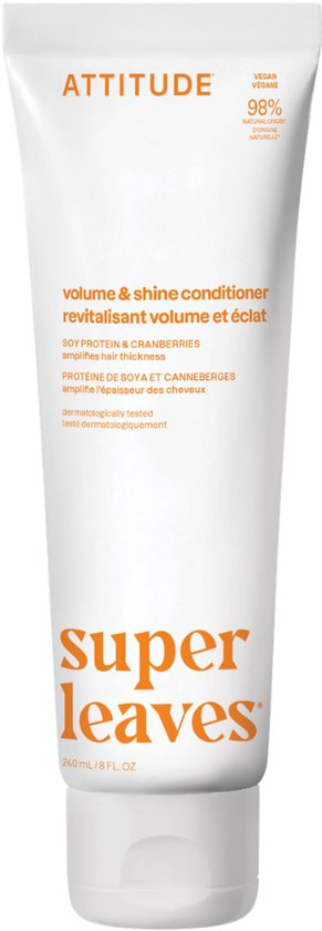 Witte tube Attitude Super Leaves conditioner met oranje tekst: 'volume & shine', 'SOY PROTEIN & CRANBERRIES', 'dermatologically tested', 'super leaves'.