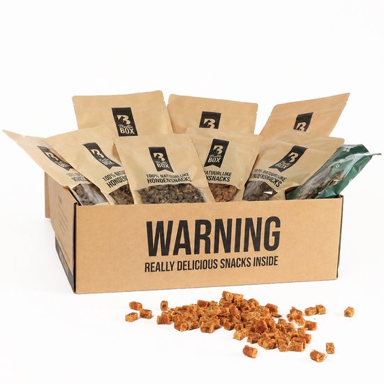 Bello Box met 7 zakjes natuurlijke hondensnacks, waaronder gedroogde vis en vlees. Een paar snacks liggen voor de doos.