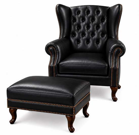 Zwarte lederen wingback fauteuil met capitonné rugleuning en voetenbankje, versierd met koperen spijkertjes.