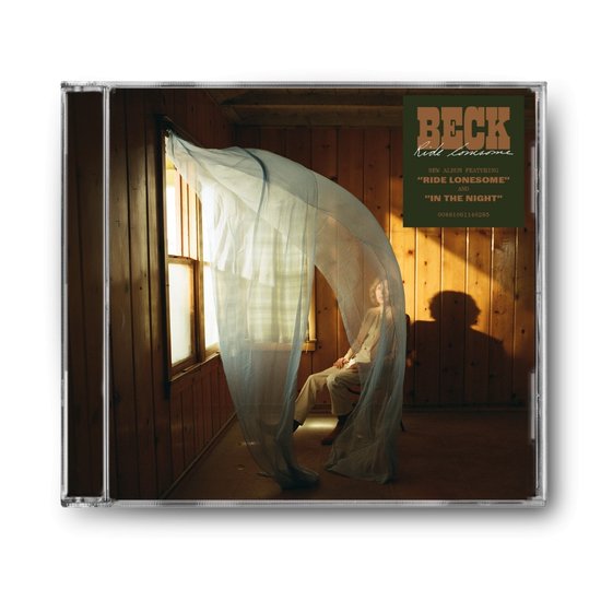Pochette de CD de Beck - Ride Lonesome. Un homme assis dans une pièce aux murs en bois, avec une fenêtre drapée de tulle bleu et le texte 'BECK RIDE LONESOME'.