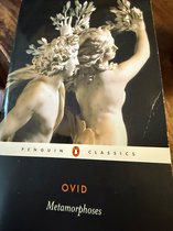 Livre avec couverture noire, titre 'OVID Metamorphoses' et illustration de deux statues en marbre d'hommes couronnés de lauriers.