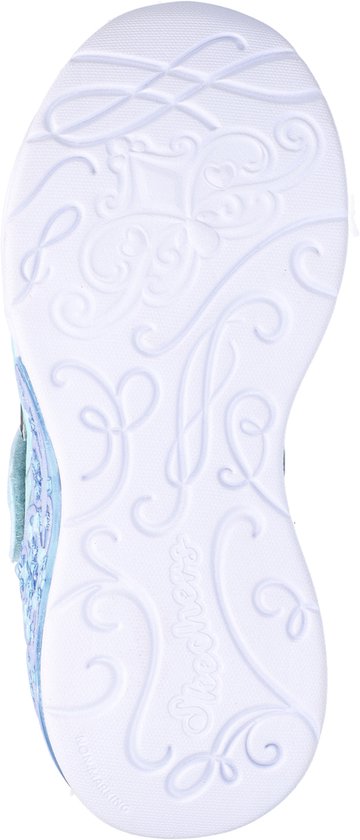 Witte sneakerzool met sierlijke patronen.