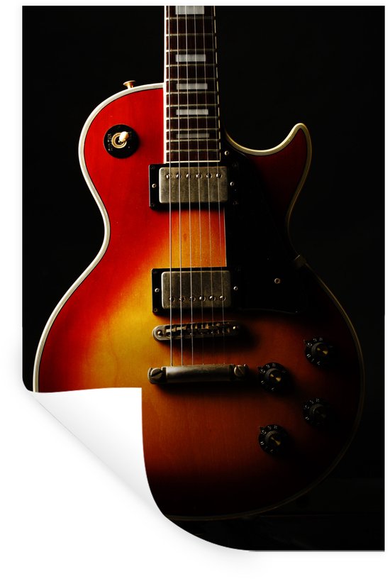 Guitare électrique aux couleurs rouge et orange coucher de soleil, sur fond noir.