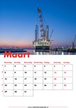 Kalenderpagina Maart met een grote offshore kraan in de haven van Rotterdam bij zonsopgang.
