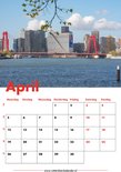 Kalenderpagina April met de skyline van Rotterdam en de rode Rijnbrug, gezien vanaf het water.