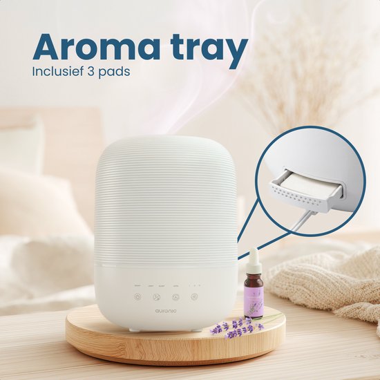 Humidificateur Auraonic blanc avec plateau aromatique et huile de lavande.