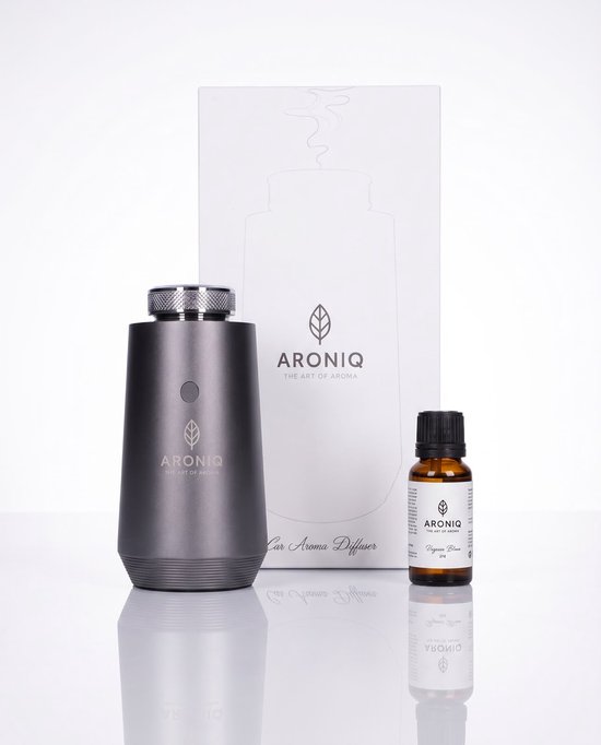 Donkergrijze Aronıq aroma diffuser met zilverkleurige dop en een flesje etherische olie ernaast.