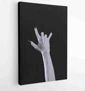 Canvas schilderij - Pale monster hand showing heavy metal symbol, Halloween theme -  Productnummer 530373928 - 40-30 Vertical