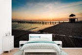 Behang - Fotobehang Kleurrijke zonsondergang op het strand van Isla Mujeres in Mexico - Breedte 420 cm x hoogte 280 cm