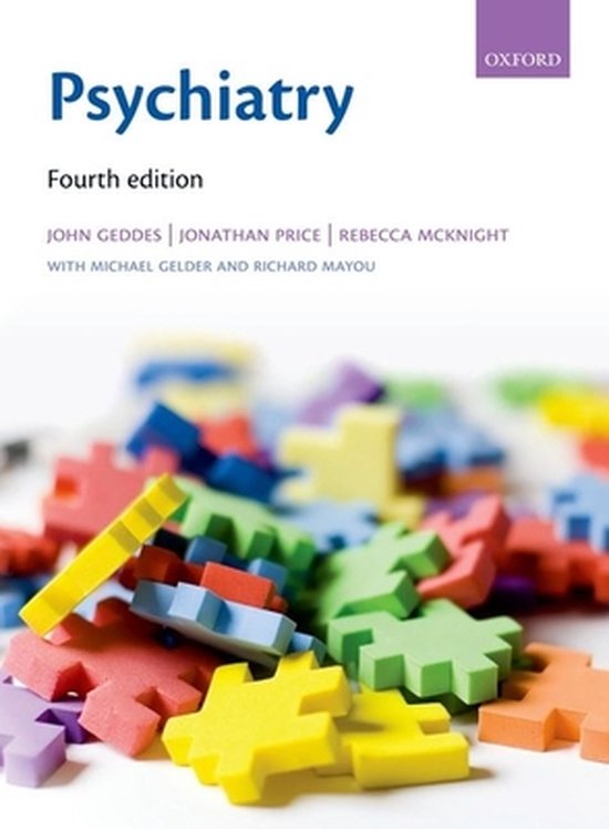 Livre "Psychiatry Fourth edition" avec un tas de pièces de puzzle colorées au premier plan.