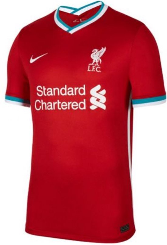 Rood Liverpool thuisshirt voor kids met witte kraag en teal accenten. Nike logo en "Standard Chartered" logo zichtbaar.