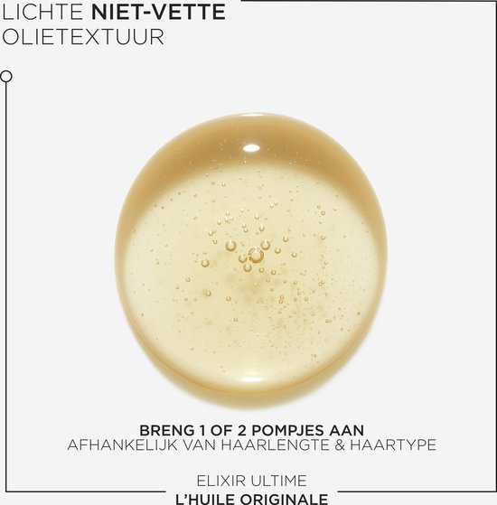 Close-up van een druppel Kérastase Elixir Ultime haarolie met bubbels.