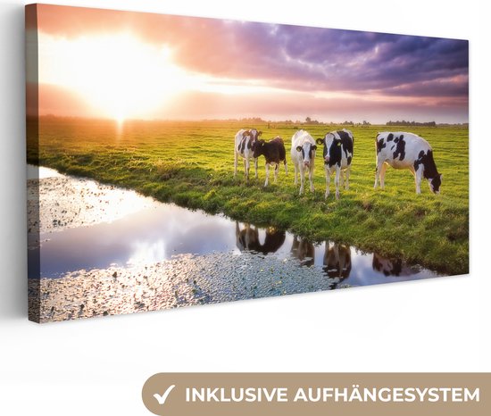 Tableau sur toile Vaches pendant un coucher de soleil - 160x80 cm - Décoration murale Art