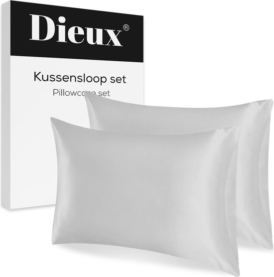 Een doos met de tekst 'Dieux® Kussensloop set' naast twee zilverkleurige satijnen kussenslopen.