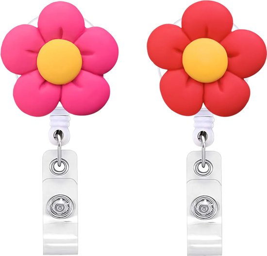Twee bloem badgehouders: één roze en één rode, met gele knoppen en clips.