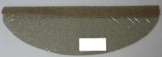 Onderkant van een beige trapmat met antislip noppen en plakrand.