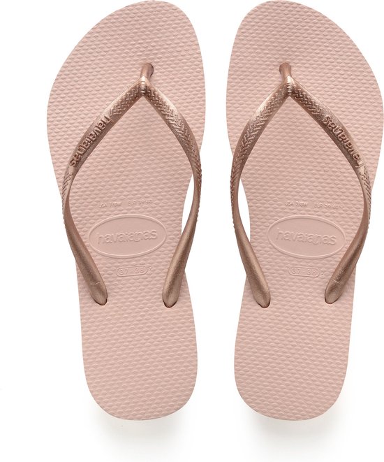 Roze Havaianas teenslippers met glitterbandjes.