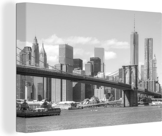 Canvas Schilderij Brooklyn Bridge in Amerika onder een e hemel - zwart wit - Wanddecoratie