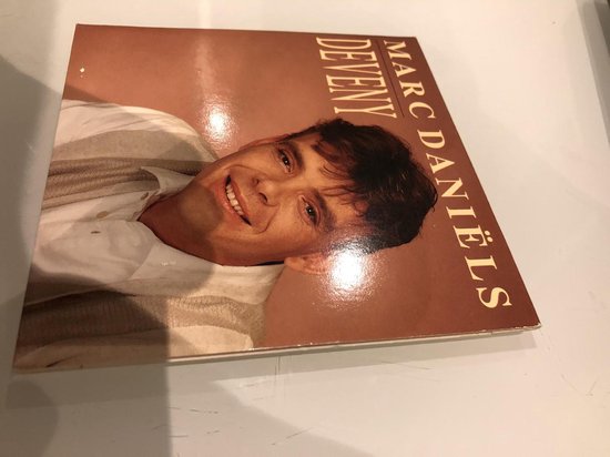 Marc Daniëls Deveny cd-single hoes met lachende man.