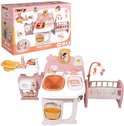 Doos van Smoby Baby Nurse poppenverzorger in roze en wit, met afbeeldingen van de speelset en accessoires.