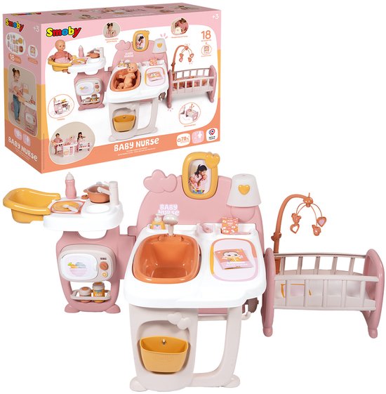 Doos van Smoby Baby Nurse poppenverzorger in roze en wit, met afbeeldingen van de speelset en accessoires.