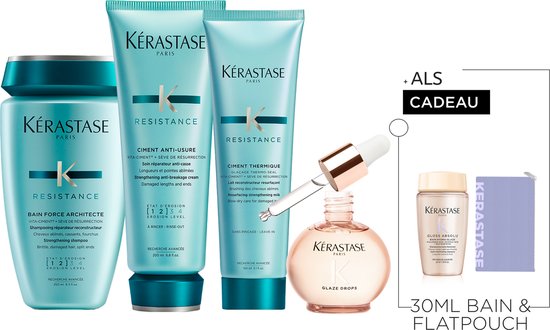 Coffret cadeau Kérastase comprenant shampooing, après-shampooing, soin protecteur de chaleur, huile, mini shampooing et trousse de toilette.