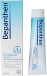 Doos en tube Bepanthen Verzorgende Crème, 100g, wit met blauwe opdruk.