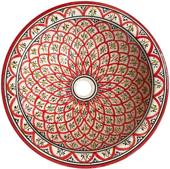 Keramische waskom met een ingewikkeld rood, geel en groen bloemenpatroon in het midden.