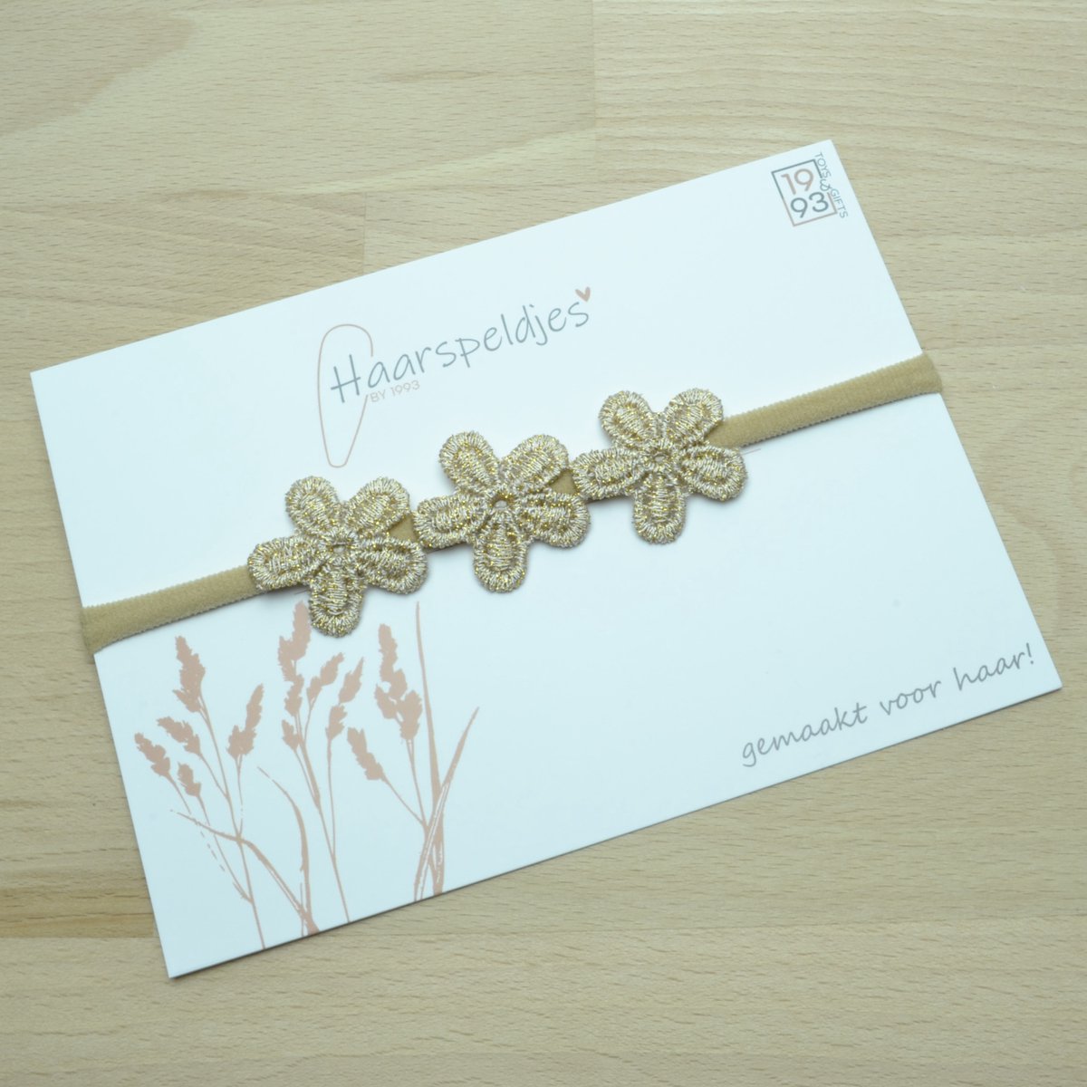 Elastieken haarbandje Lune by 1993 - 3 gouden bloemetjes - haaraccessoires