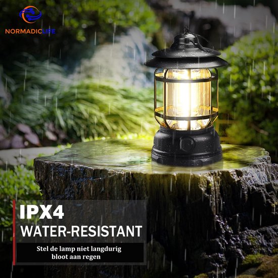 Lanterne de camping noire avec lumière LED sur un rocher, avec "IPX4 Résistant à l'eau".