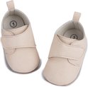 Licht beige baby schoentjes van PU leer met klittenbandsluiting. De binnenkant toont maat '1'.
