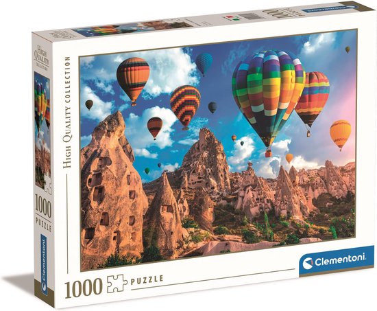 Boîte de puzzle de 1000 pièces représentant des montgolfières multicolores au-dessus des formations rocheuses de Cappadoce.