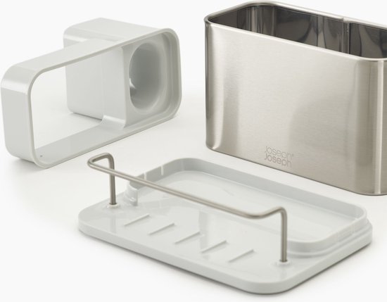 Zilverkleurige gootsteen organizer, beige onderzetter en witte scheidingswand met handvatten.